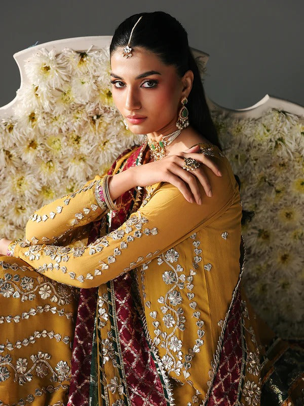 Yellow embroidered traditional dress with jewelry, festive attire