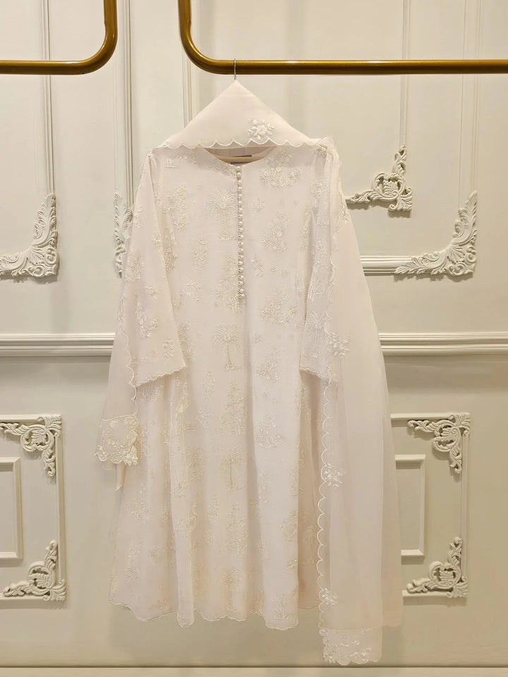 AGHA NOOR Cotton Net Suit - Pakistani Embroidered | 3 Pc displayed on hanger with intricate white embroidery and scalloped dupatta. Elegant formal wear.