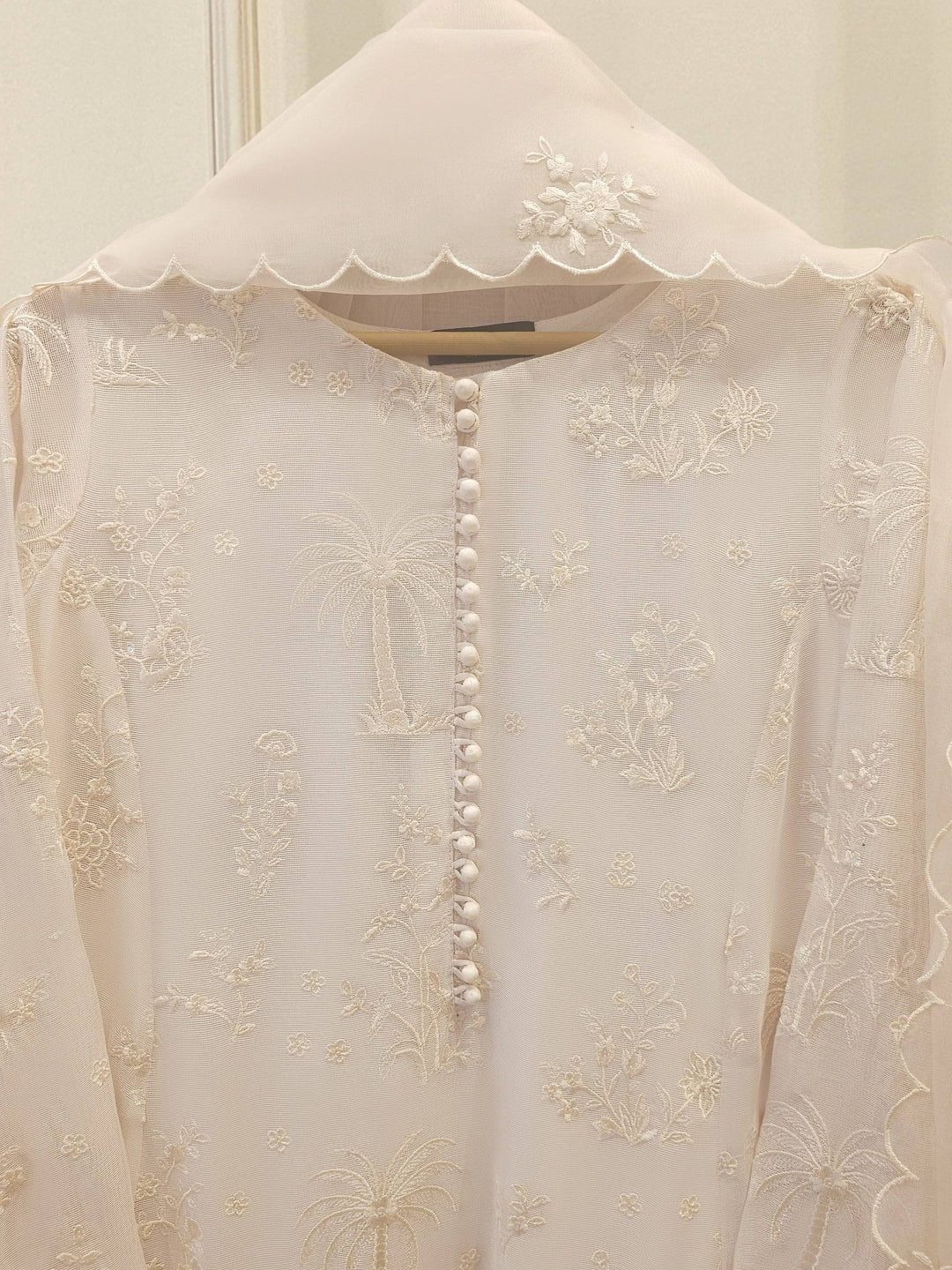 Close-up of AGHA NOOR Cotton Net Suit - Pakistani Embroidered | 3 Pc highlighting button detailing and fine floral embroidery on shirt front.