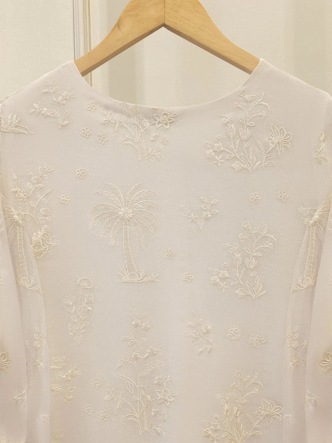 Back neckline of AGHA NOOR Cotton Net Suit - Pakistani Embroidered | 3 Pc with intricate white thread embroidery on sheer cotton net.