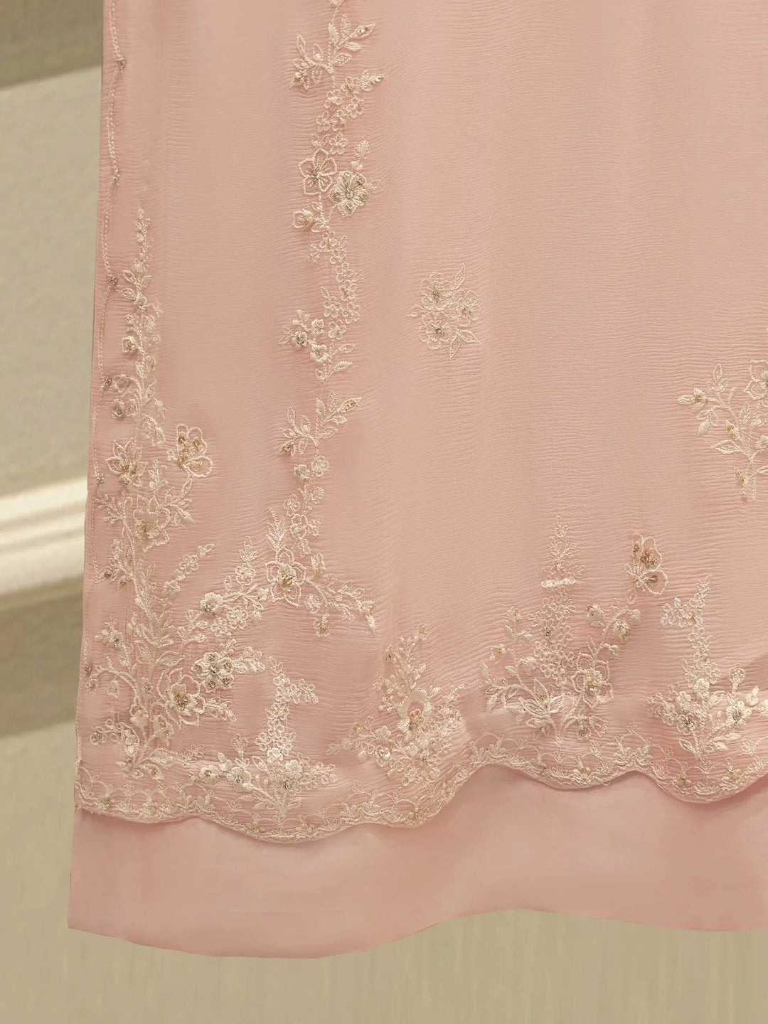 Hemline embroidery of AGHA NOOR Embroidered Chiffon Suit - Dress with floral patterns enhancing the elegance of the pink chiffon shirt.