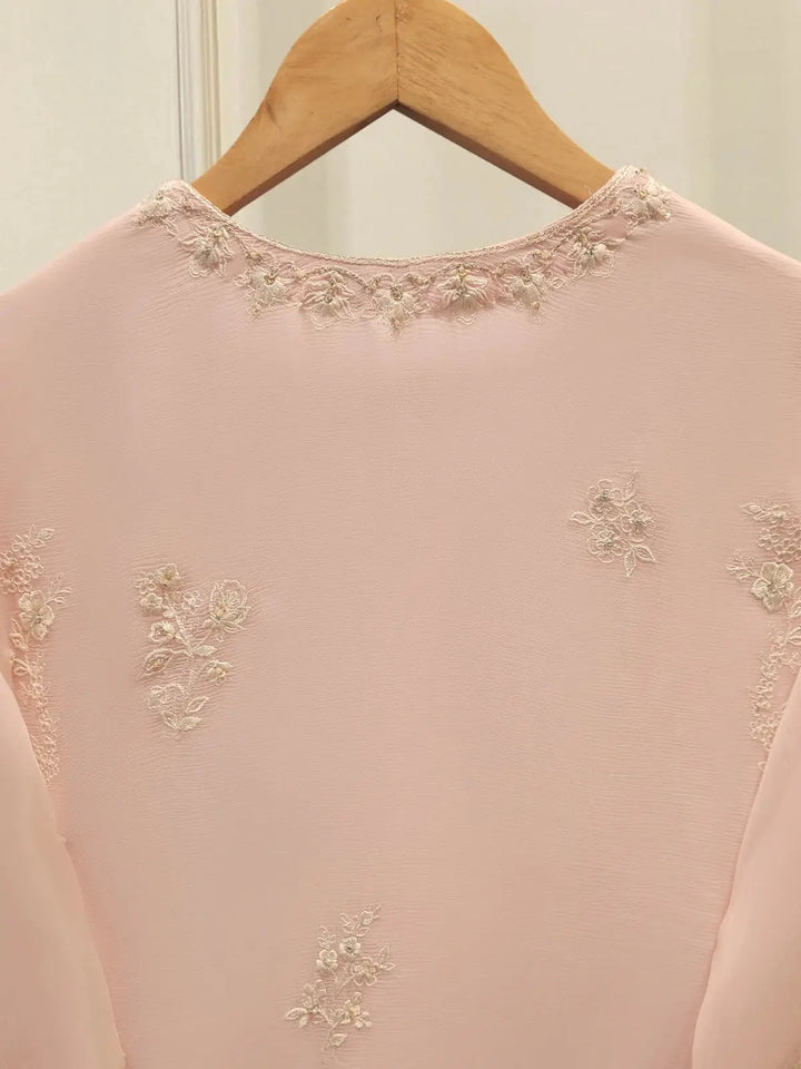 Back neckline embroidery of AGHA NOOR Embroidered Chiffon Suit - Dress with subtle floral detailing on the pink chiffon shirt.