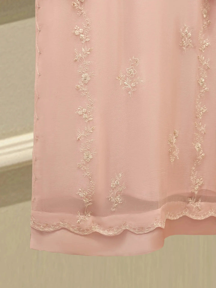 Lower back embroidery of AGHA NOOR Embroidered Chiffon Suit - Dress featuring delicate floral motifs on pink chiffon fabric.