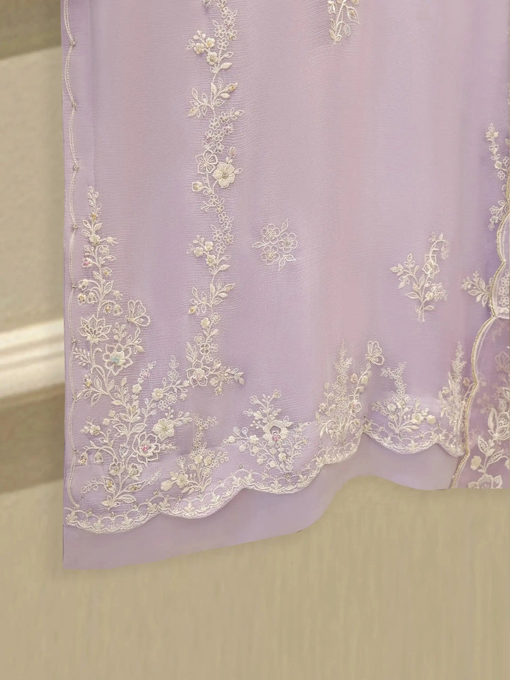 Hemline embroidery of AGHA NOOR Chiffon Suit with scalloped edges and floral motifs, adding elegance to the lilac ensemble.
