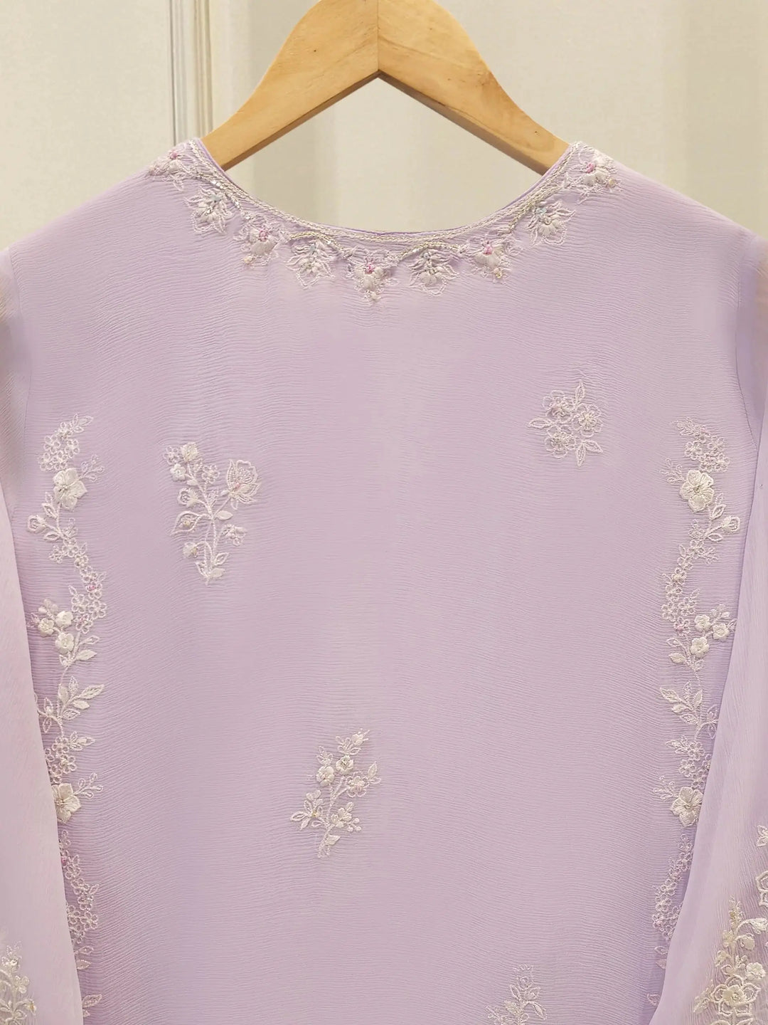 Close-up of back neckline embroidery on AGHA NOOR Chiffon Suit, highlighting delicate floral threadwork on soft lilac chiffon fabric.