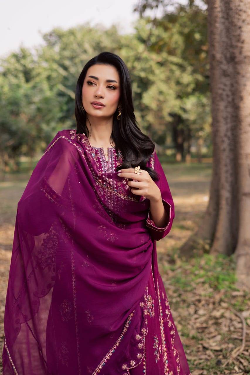 Model draped in embroidered dupatta from BATIK Sole 3Pc Khaddar dress, showcasing luxurious texture and festive design for women.