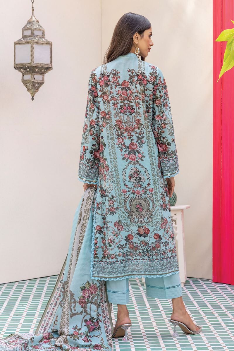 pakistani dresses online usa a woman in a blue suit with floral print