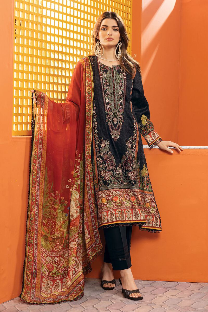 pakistani dresses online usa a woman standing in front of a wall wearing a black and red dress