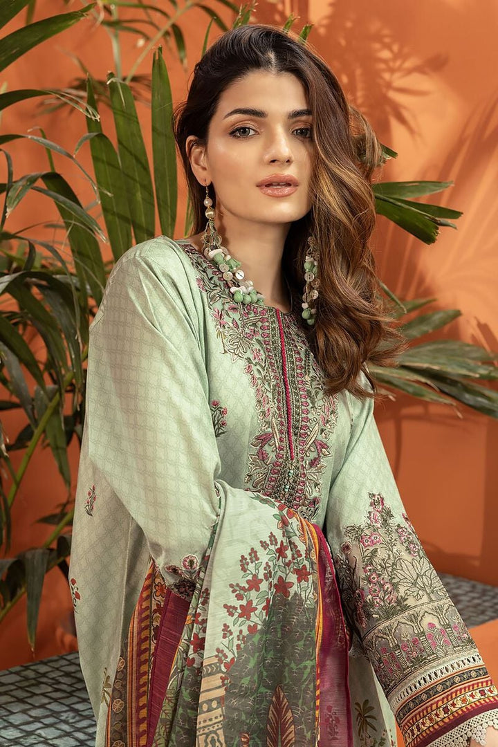 shop pakistani dresses online a woman wearing a green and red dress