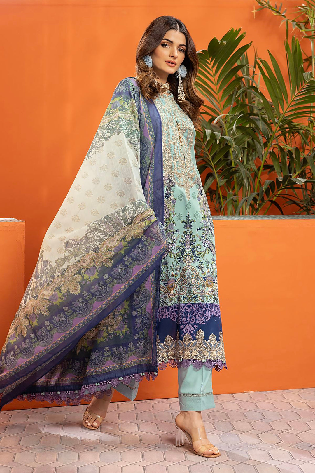 pakistani outfits usa a woman in a blue and white outfit