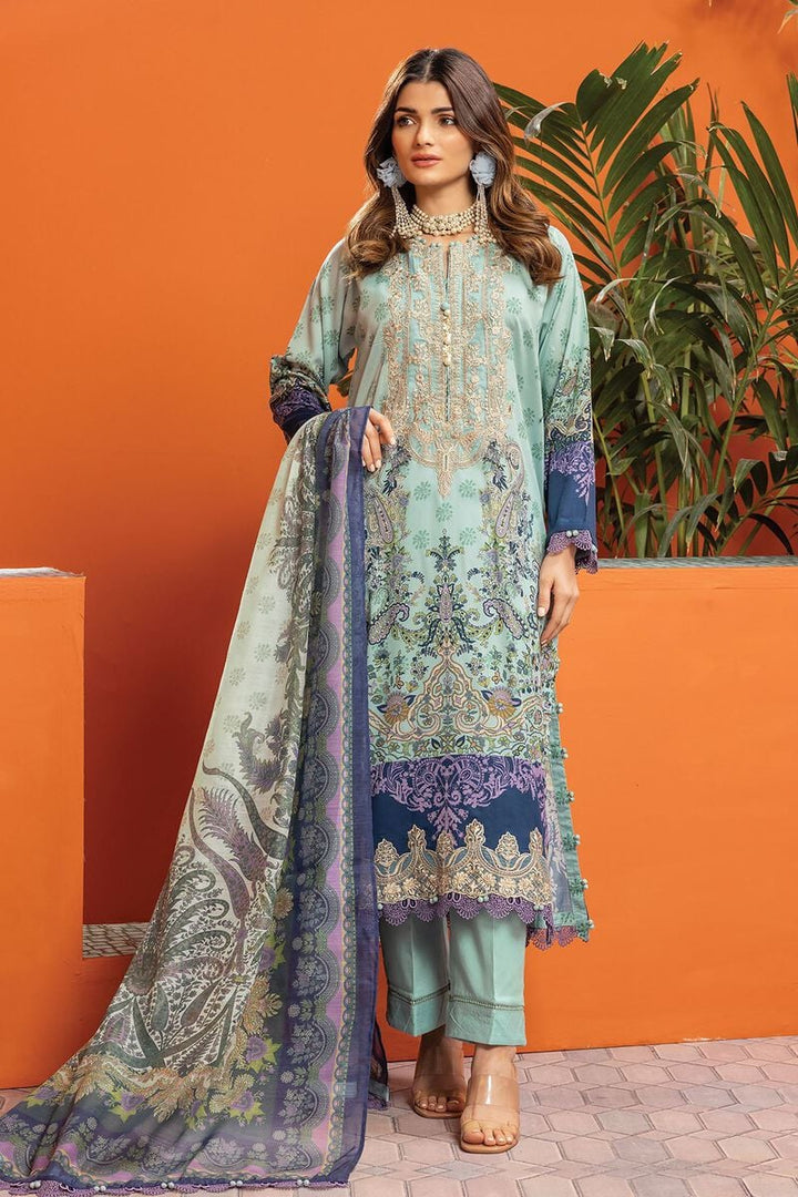 pakistani outfits usa a woman wearing a green and blue suit