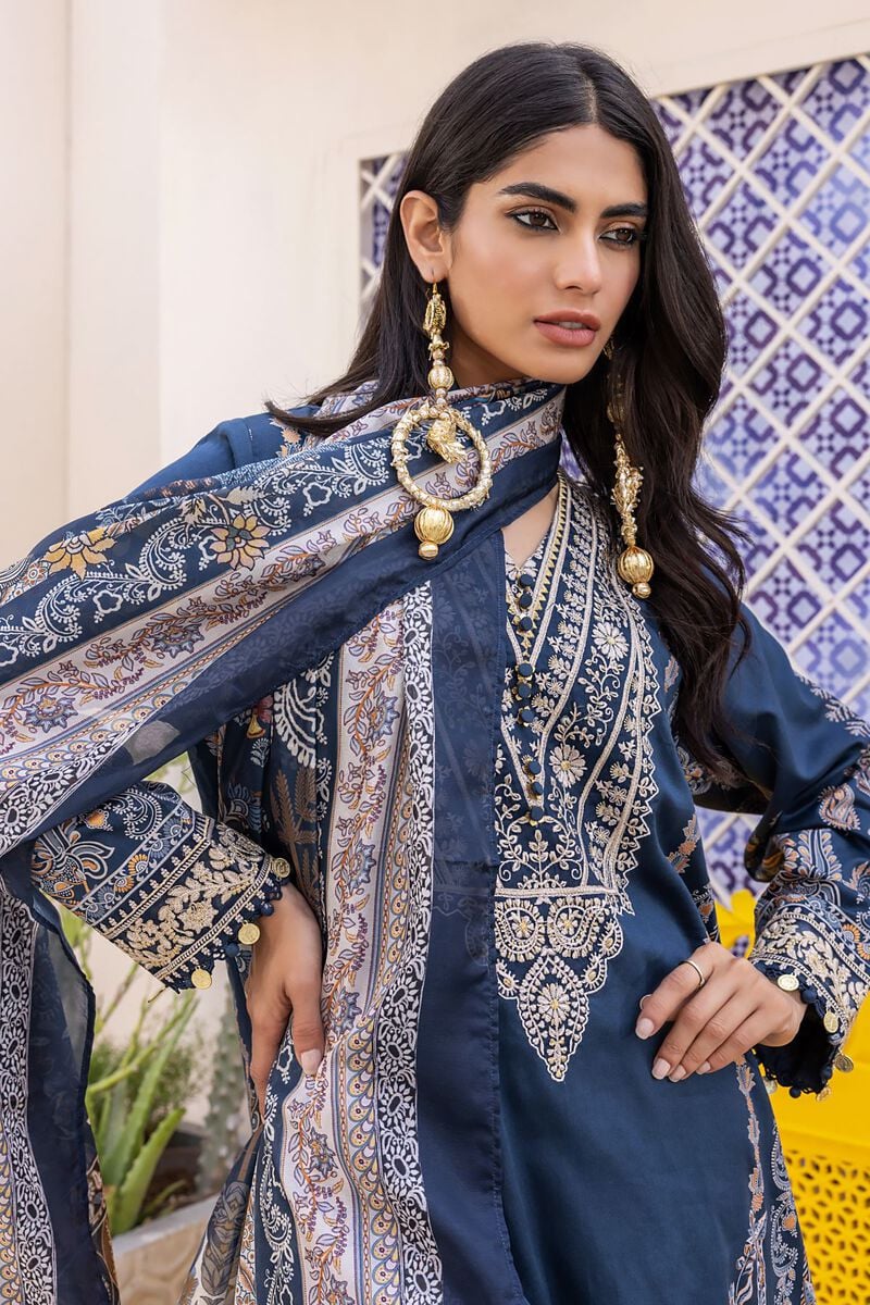 pakistani clothes online a woman wearing a blue and gold outfit