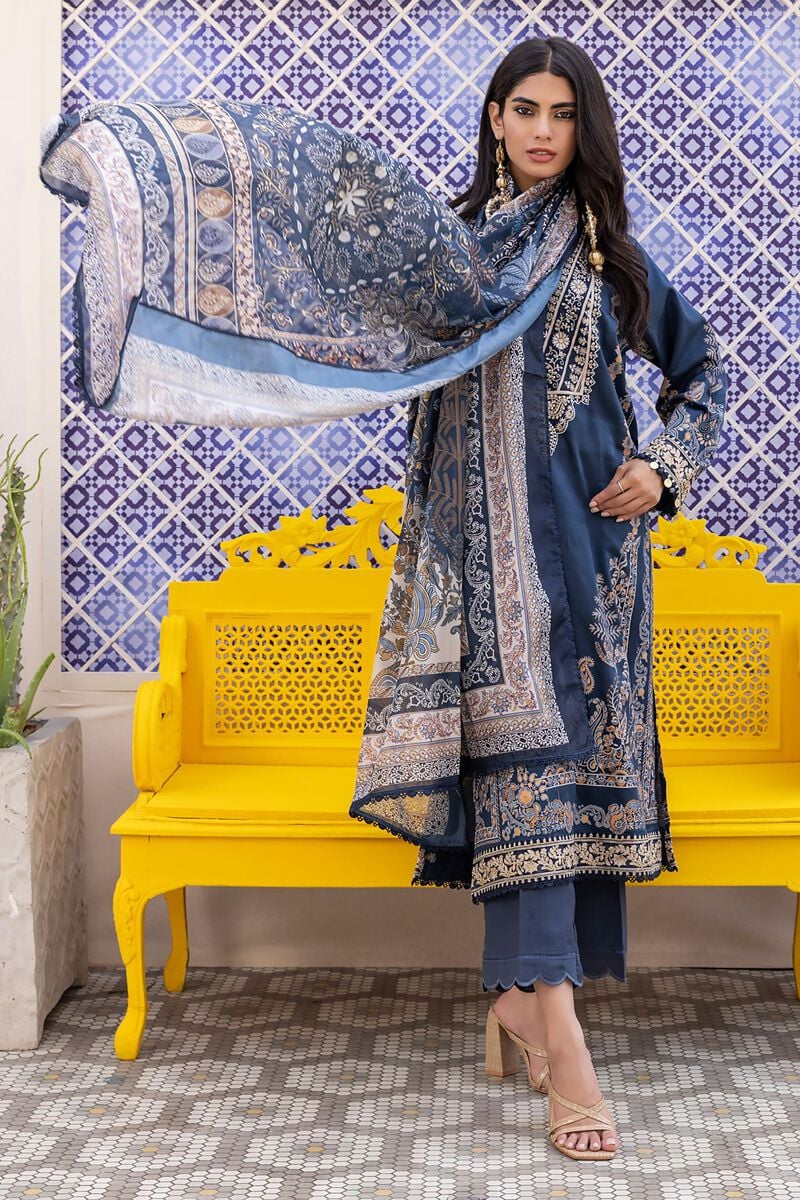 pakistani clothes online a woman standing in front of a yellow bench
