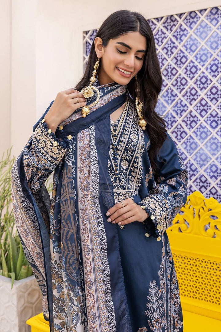 pakistani clothes online a woman wearing a blue and gold dress