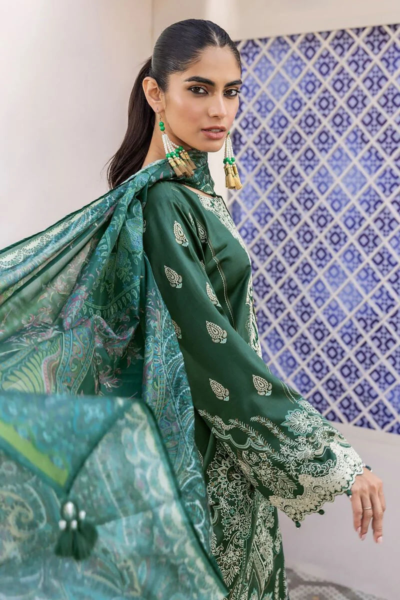 pakistani casual clothes a woman in a green dress holding an umbrella