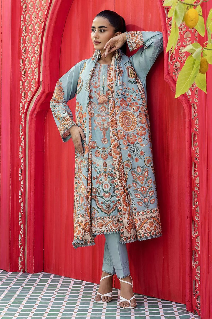 Online Pakistani Clothes a woman standing in front of a red door