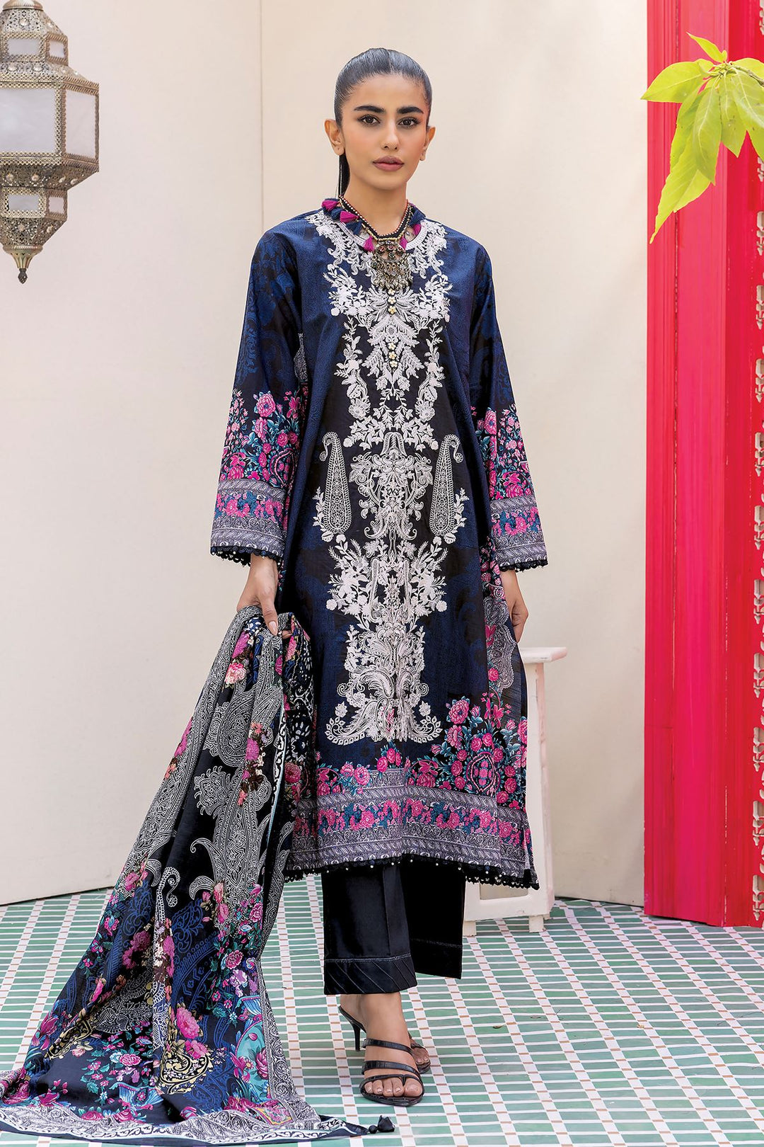 Pakistani Branded Clothes a woman in a black and blue outfit
