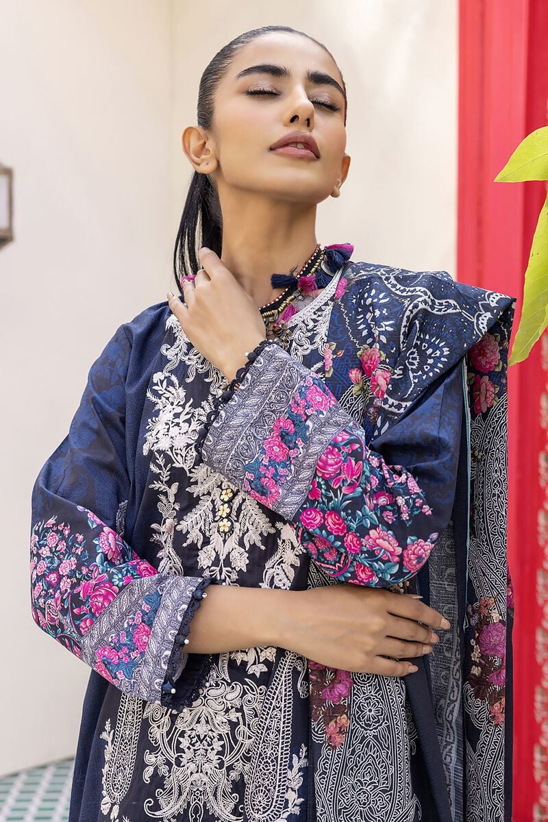Pakistani Branded Clothes a woman wearing a blue and pink dress
