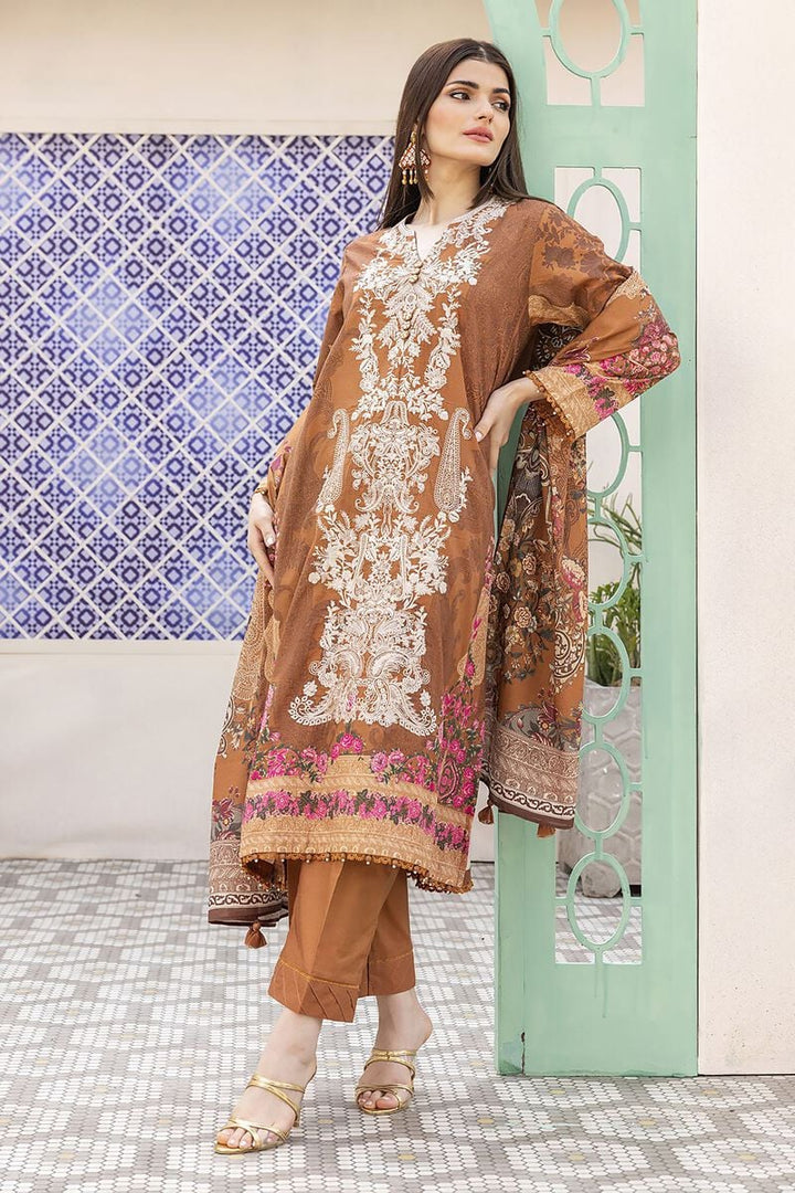 pakistani suits online a woman standing in front of a wall wearing a brown dress