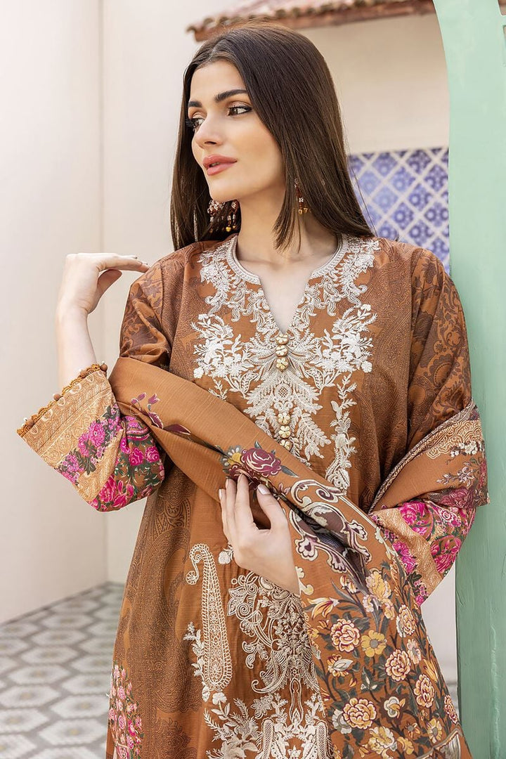 pakistani suits online a woman wearing a brown and pink dress