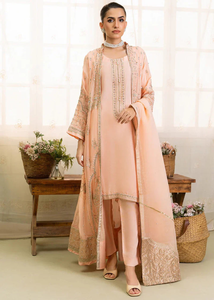 Full front view of peach Pakistan gown dress woman with detailed embroidery, perfect for festive and formal wear.