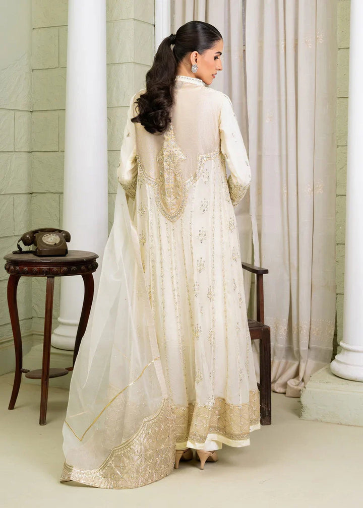 Back view of ivory Pakistan gown dress woman featuring embroidered panel and flowing dupatta, perfect for elegant events.