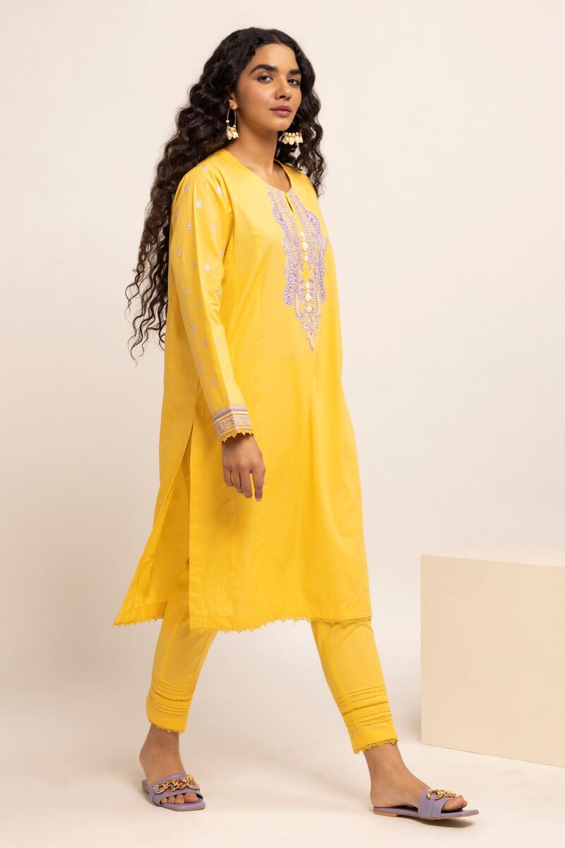 Authentic Pakistani Clothes Online a woman in a yellow tunic and pants
