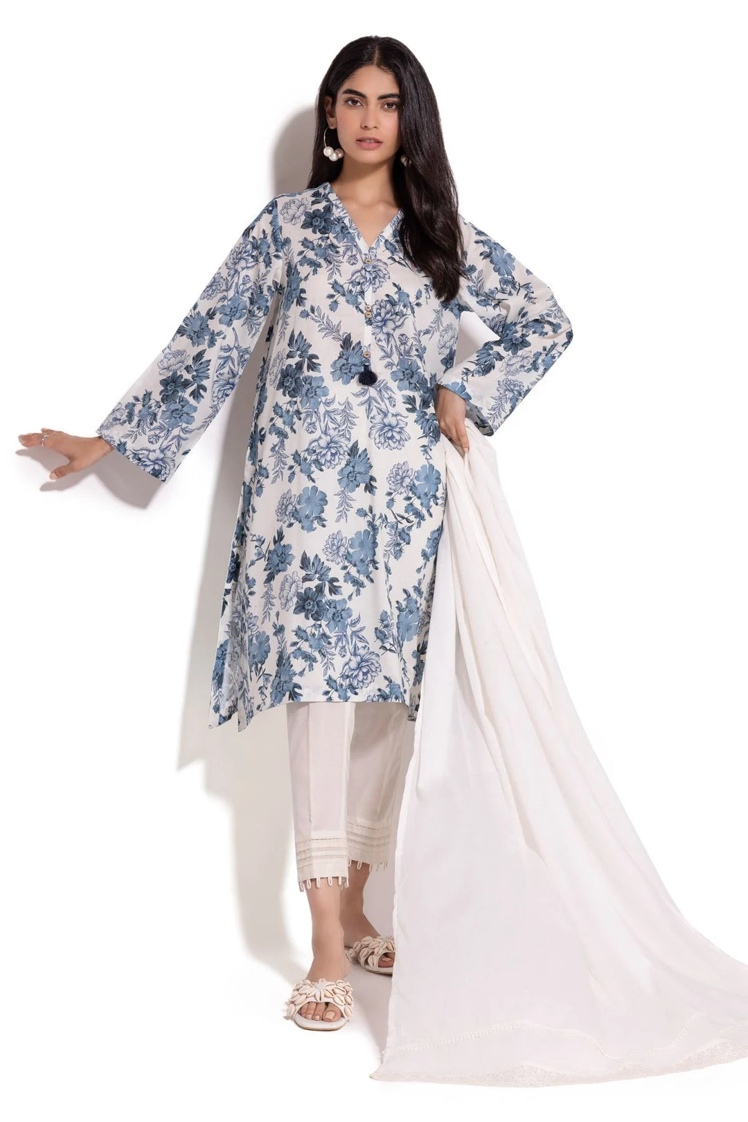 a Khaadi Design woman in a white and blue dress