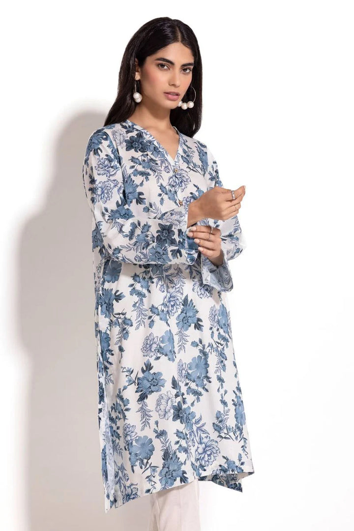 a Khaadi Design woman in a blue and white floral print dress