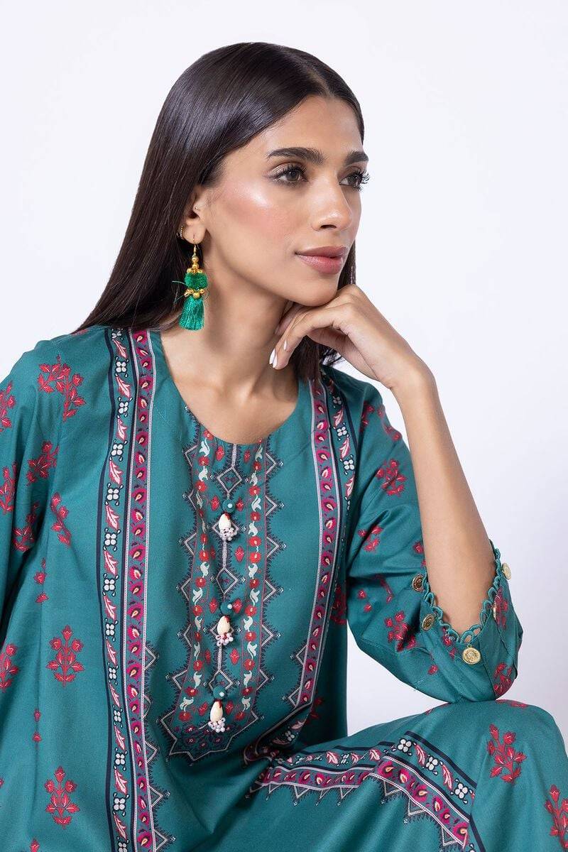 Close-up of teal green Khaadi kurta EET24638A showcasing embroidered neckline with bead embellishments and red floral patterns.