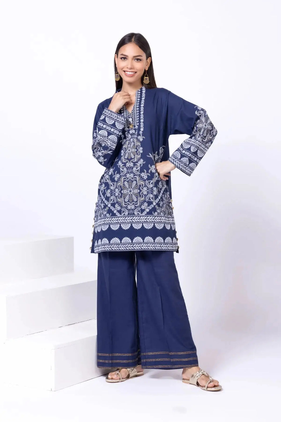 Navy blue khaadi 2-piece traditional outfit with intricate white embroidery on shirt and matching wide-leg pants.