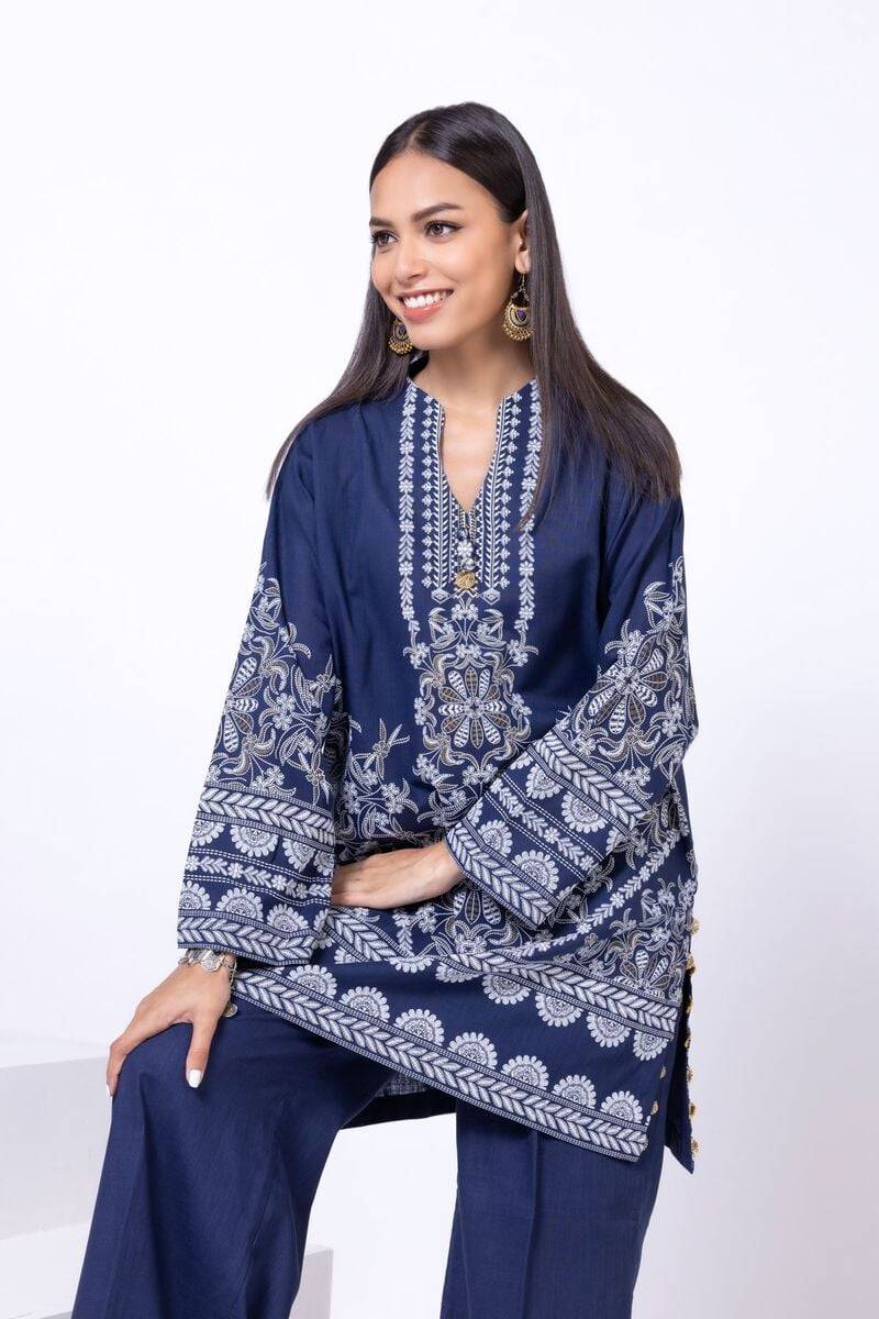 Close-up of khaadi 2-piece outfit showcasing detailed white floral embroidery on navy blue fabric.