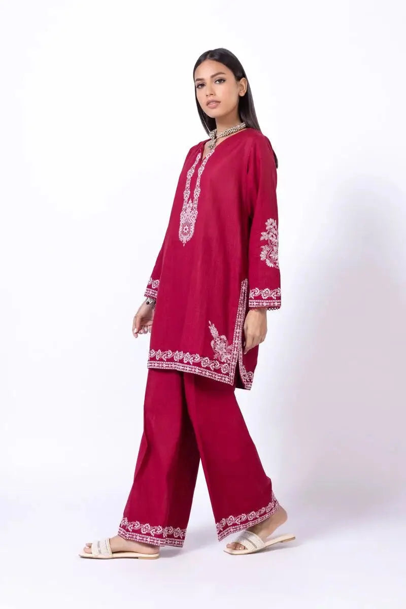 KHAADI 2P EET24701A traditional red outfit featuring intricate white embroidery on the shirt and trousers, styled with a relaxed fit.