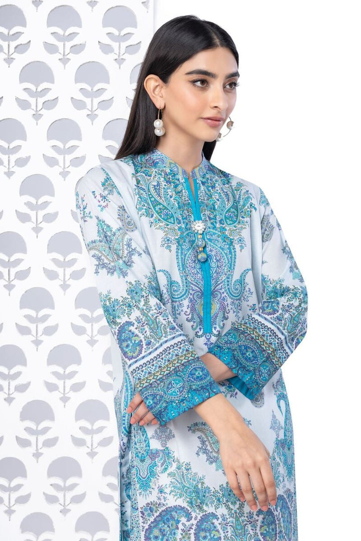 a KHAADI 1 piece SHIRT woman standing in front of a wall