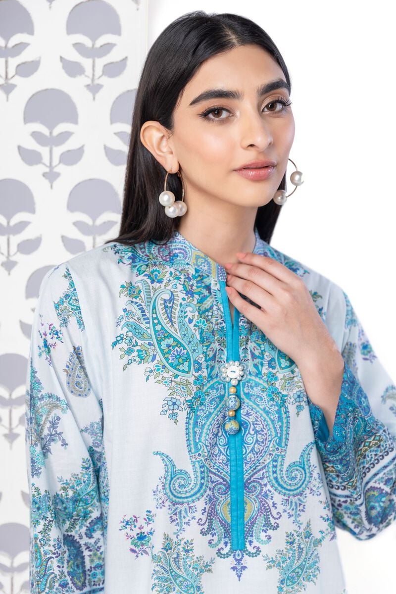 a KHAADI 1 piece SHIRT woman wearing a blue and white shirt and earrings