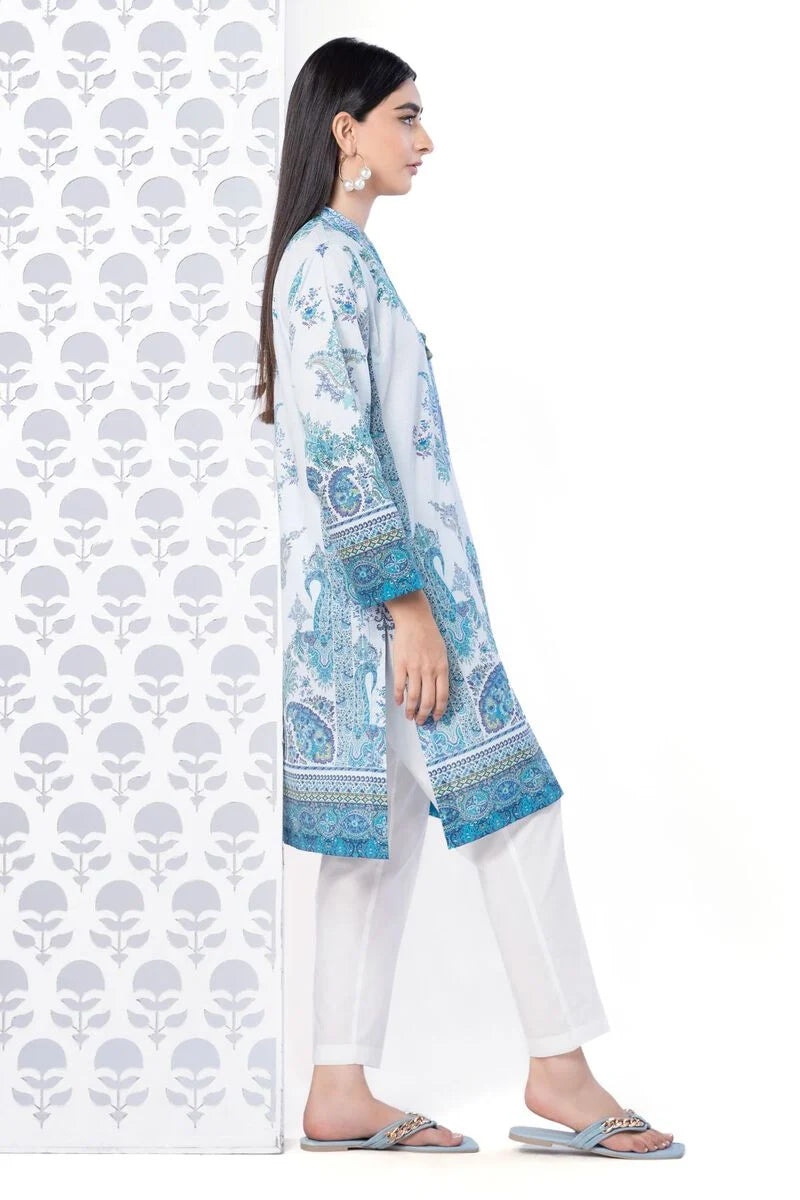 a KHAADI 1 piece SHIRT woman standing in front of a wall