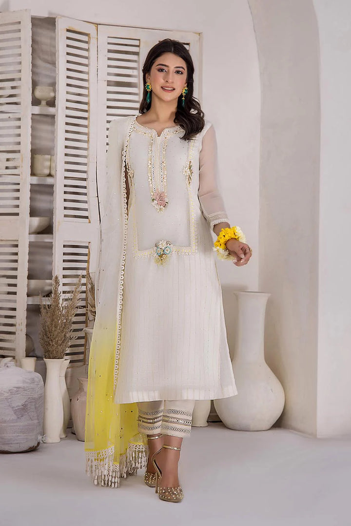 KHUDA BAKSH Ready To Wear woman in a white dress standing in front of a white wall