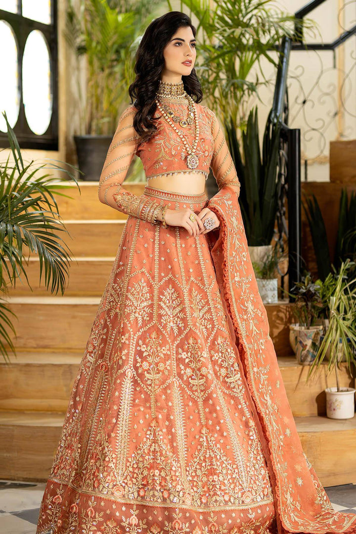 Elegant pink gown with intricate embroidery, front view