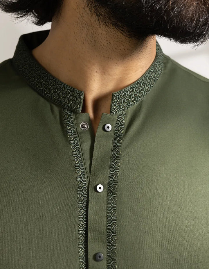 Green Kameez Shalwar - Semi-Formal | Blended Fabric zoomed-in detail of the embroidered band collar and button placket on the green kameez.