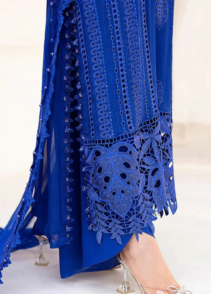 Detailed view of RANGREZA AL-4357 shirt hem featuring cutwork embroidery and lace accents on royal blue chiffon fabric for ceremonial attire.