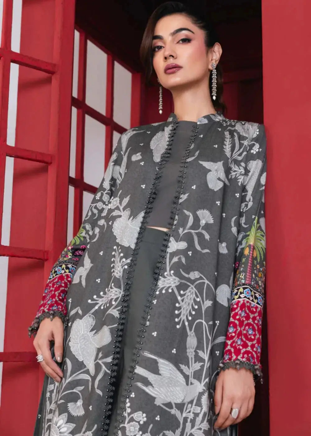 Close-up of MB-CUS25-1106-A Maria.B Stitch Suit showing detailed floral print and beadwork on the grey shirt with red embroidered cuffs.