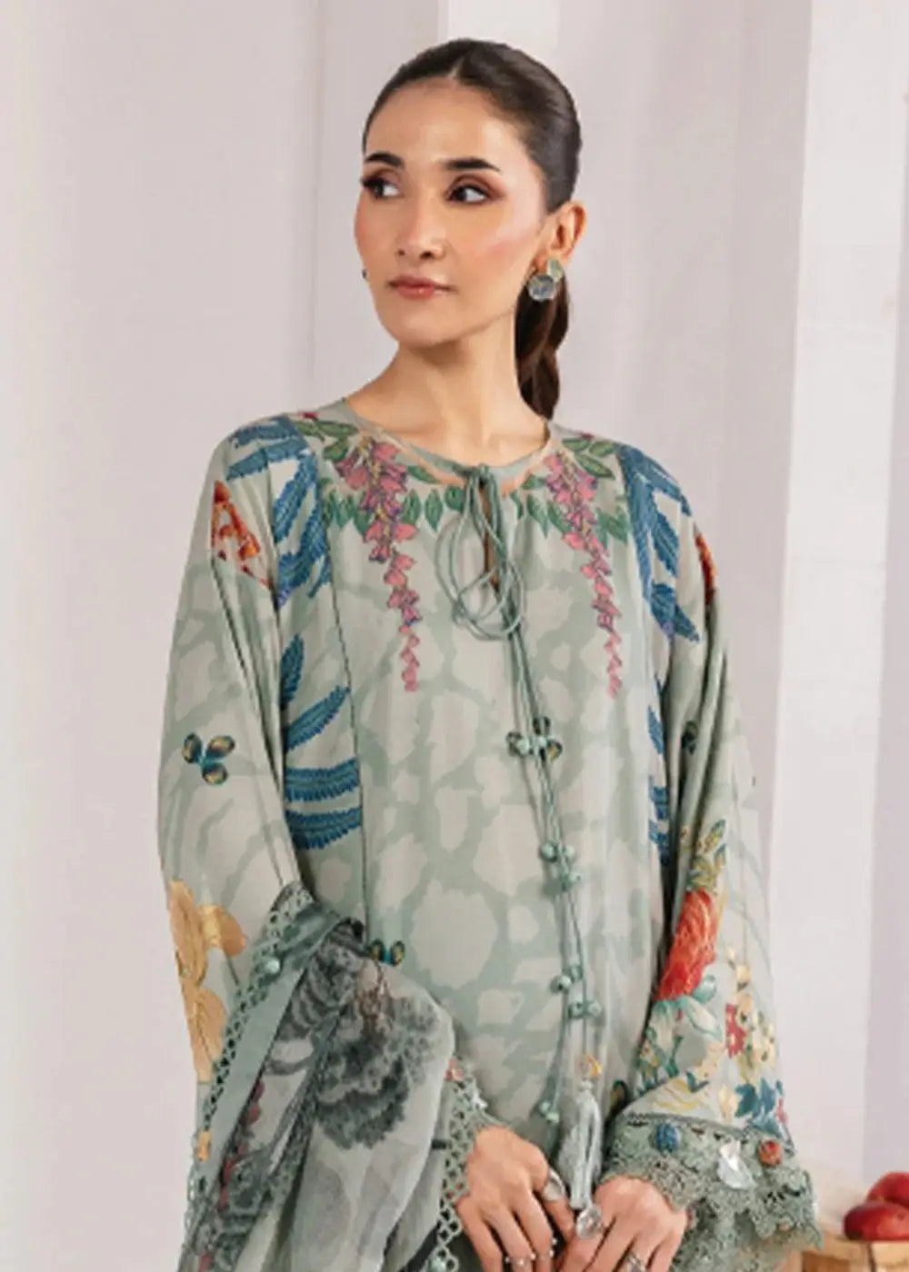 Close-up of MB-CUS25-1109-A sage green shirt featuring floral digital print, front buttons, and lace-trimmed sleeves by Maria b Pakistan.