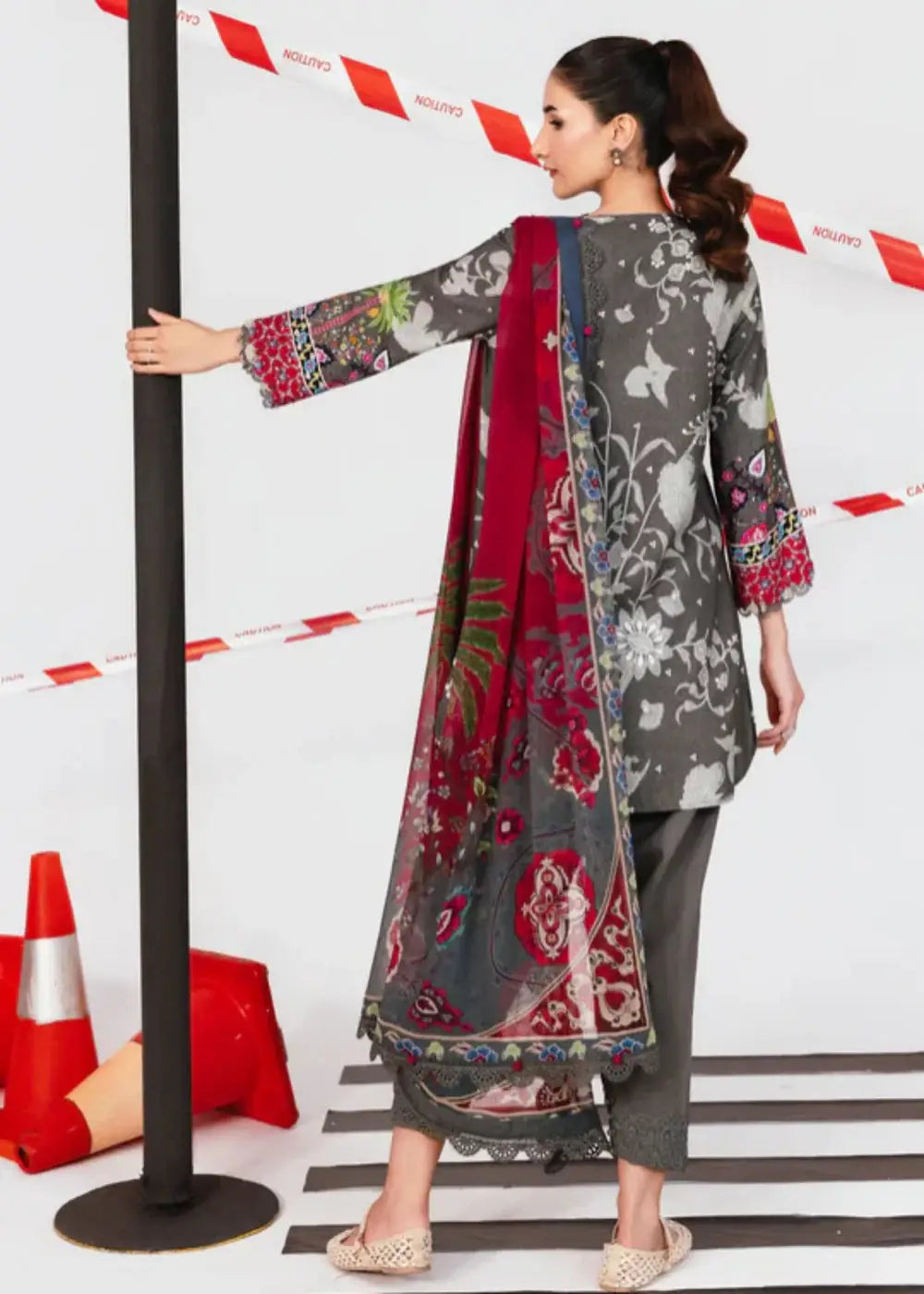 Back view of MB-CUS25-1106-A Maria.B Stitch Suit highlighting the vibrant red chiffon dupatta with floral print and grey embroidered shirt.