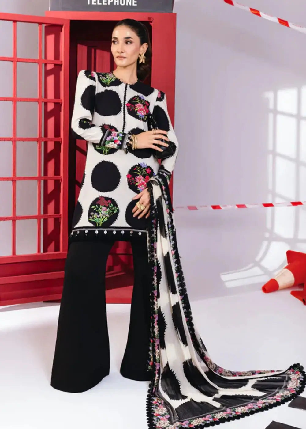 MB-CUS25-1107-B - Women's Maria b stitched dress in black and white with floral accents and chiffon dupatta, ideal for winter daily wear.