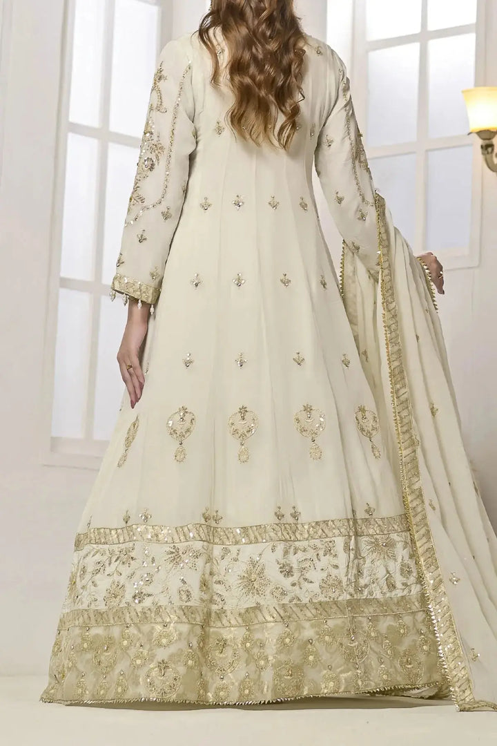 Back view of Rafia Chiffon Dress highlighting gold embroidered motifs and wide embellished hemline for special occasions.