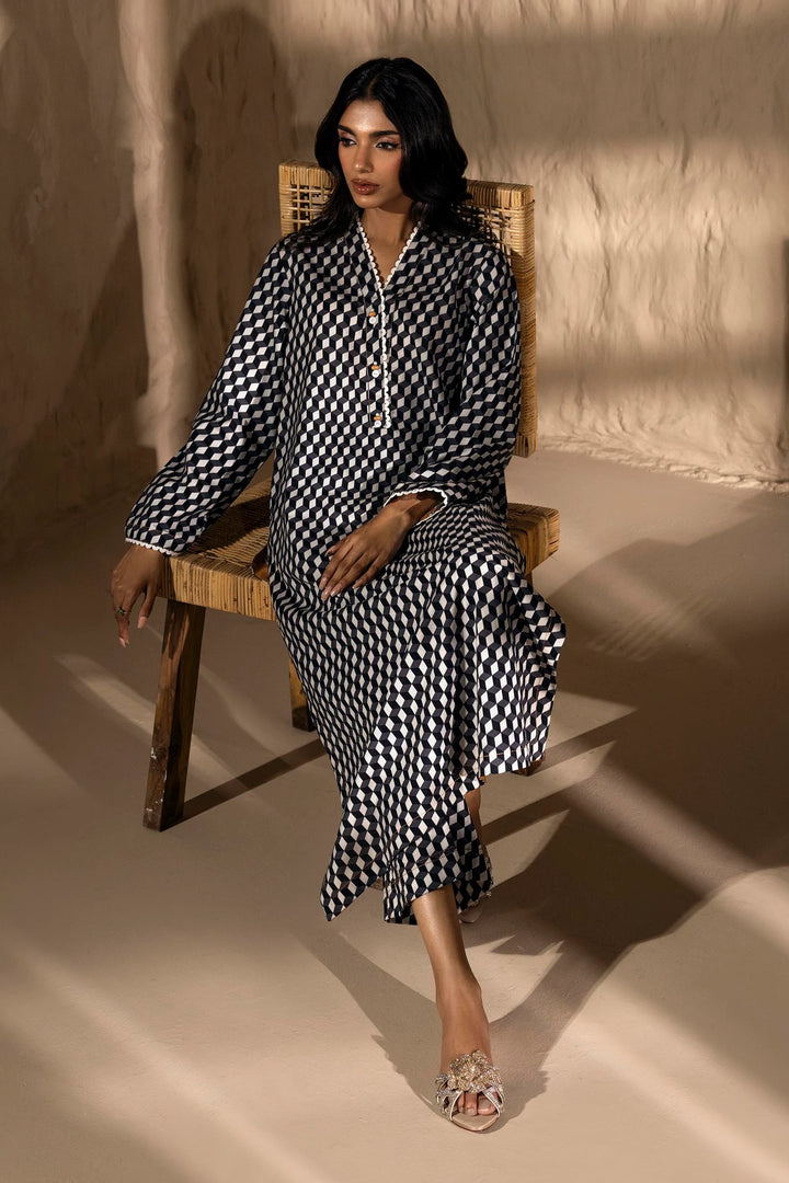 a woman sitting on a wooden chair in a room