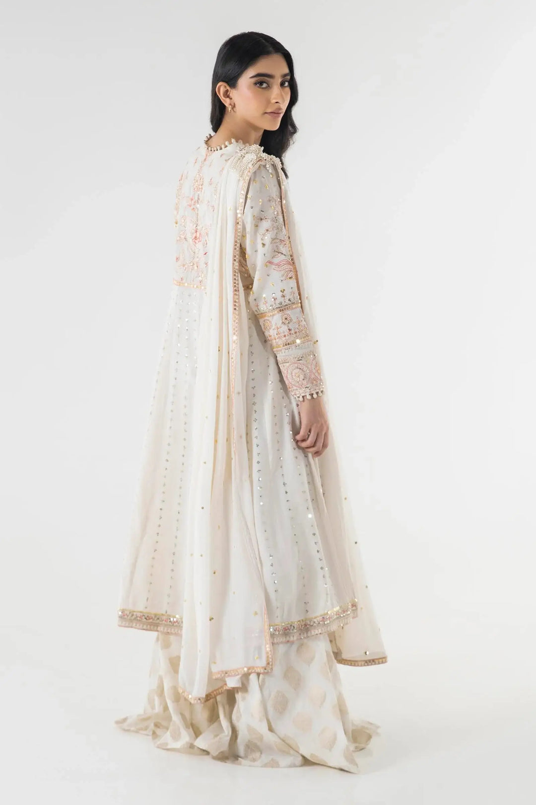 Back view of Sana Safina SS24EXE142P3 white ceremonial attire showcasing detailed embroidery and a graceful silhouette.