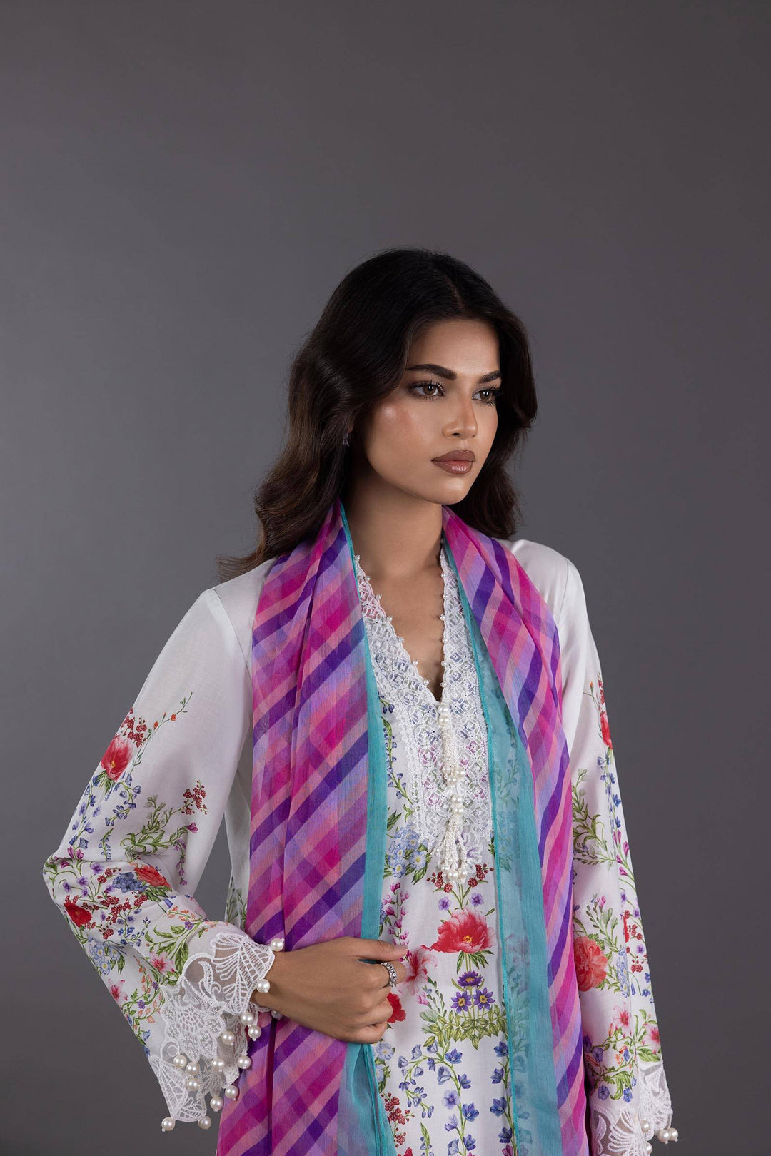 Close-up of SANA SAFINA Lawn Suit showing intricate embroidery on neckline and sleeves, styled with a vibrant purple and turquoise chiffon dupatta.