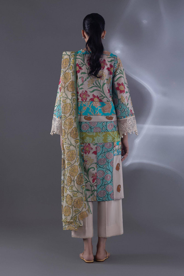 Back view of SANA SAFINA BLUE SUIT - Lawn Chiffon Shalwar 3 Piece Patch Suit with vibrant floral patterns and beige skinny shalwar.