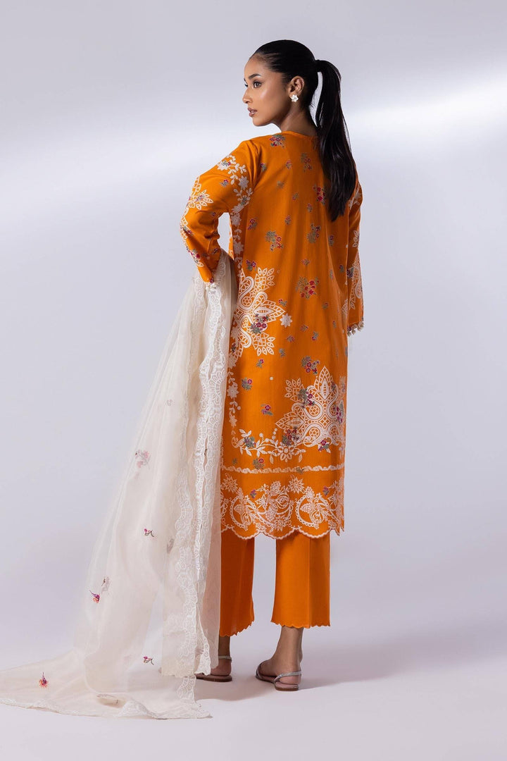 Back view of SANA SAFINA 3 Piece Lawn Suit in orange with intricate embroidery, paired with culottes and a white embroidered dupatta. Elegant ethnic outfit.
